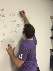 Brett McMakin, a member of SSI's NFL Combine Class and now a member of the Atlanta Falcons, signs the Pro Wall.